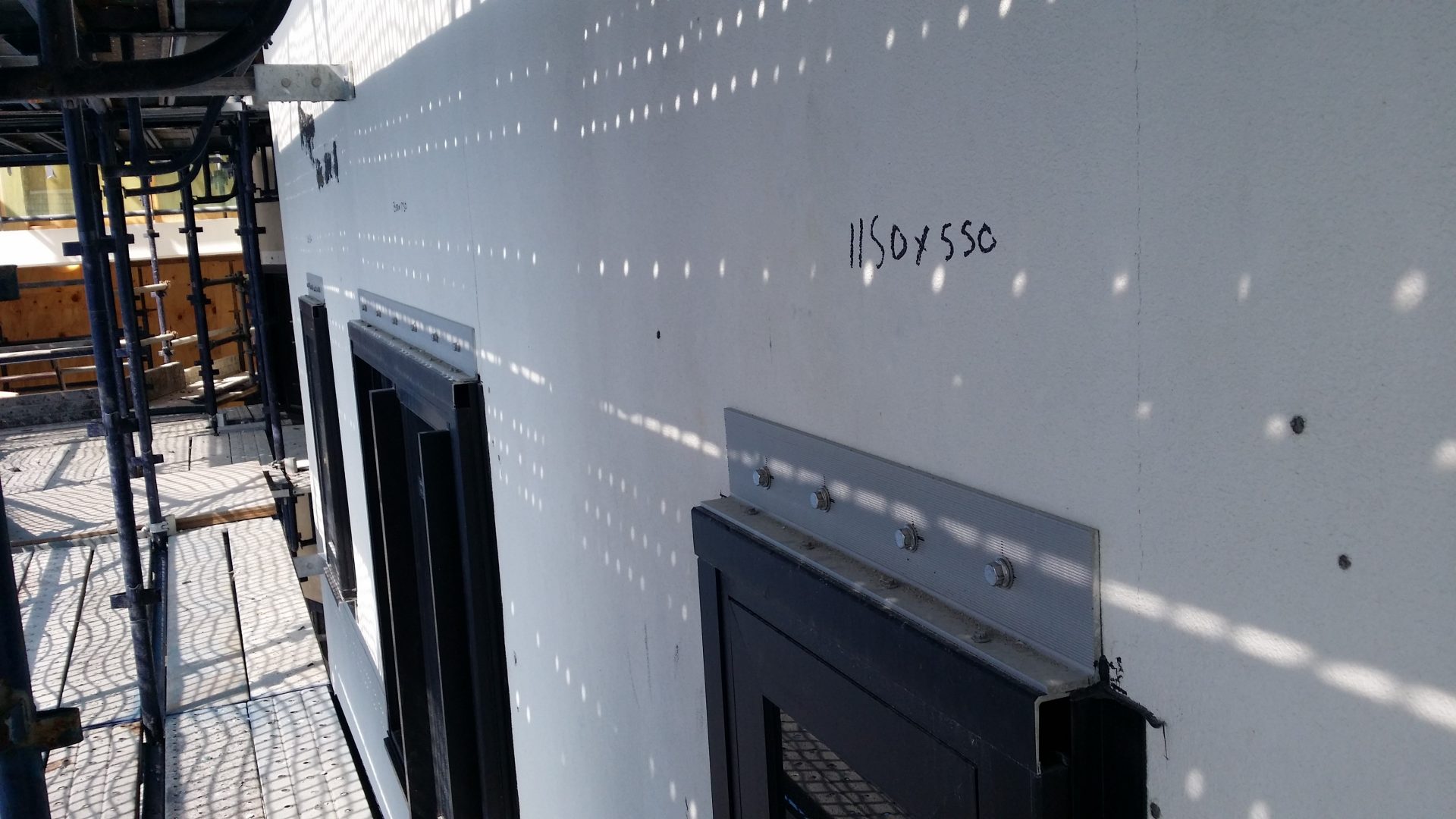 Steel window lintels secured using stainless steel Hilti HUS3 screw anchors