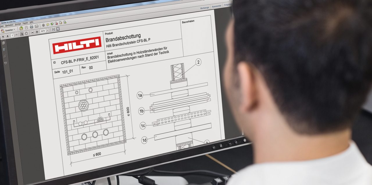 Close up rear view of a mature student using computer in the computer room
