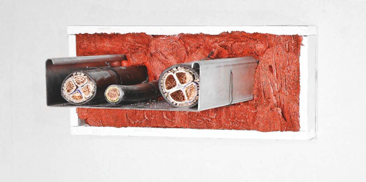 Photo of three CFS-D Firestop cable discs around a variety of electrical cables and cable bundles