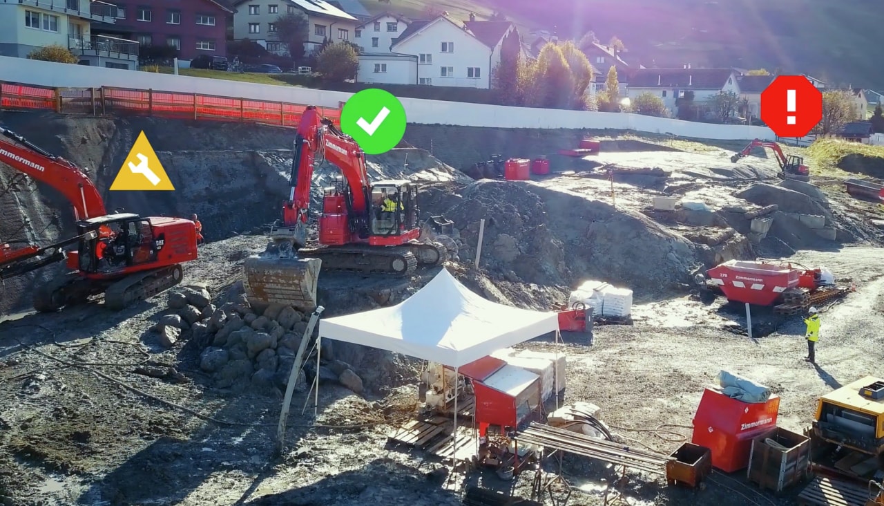 Jobsite with icons over heavy equipment showing their status