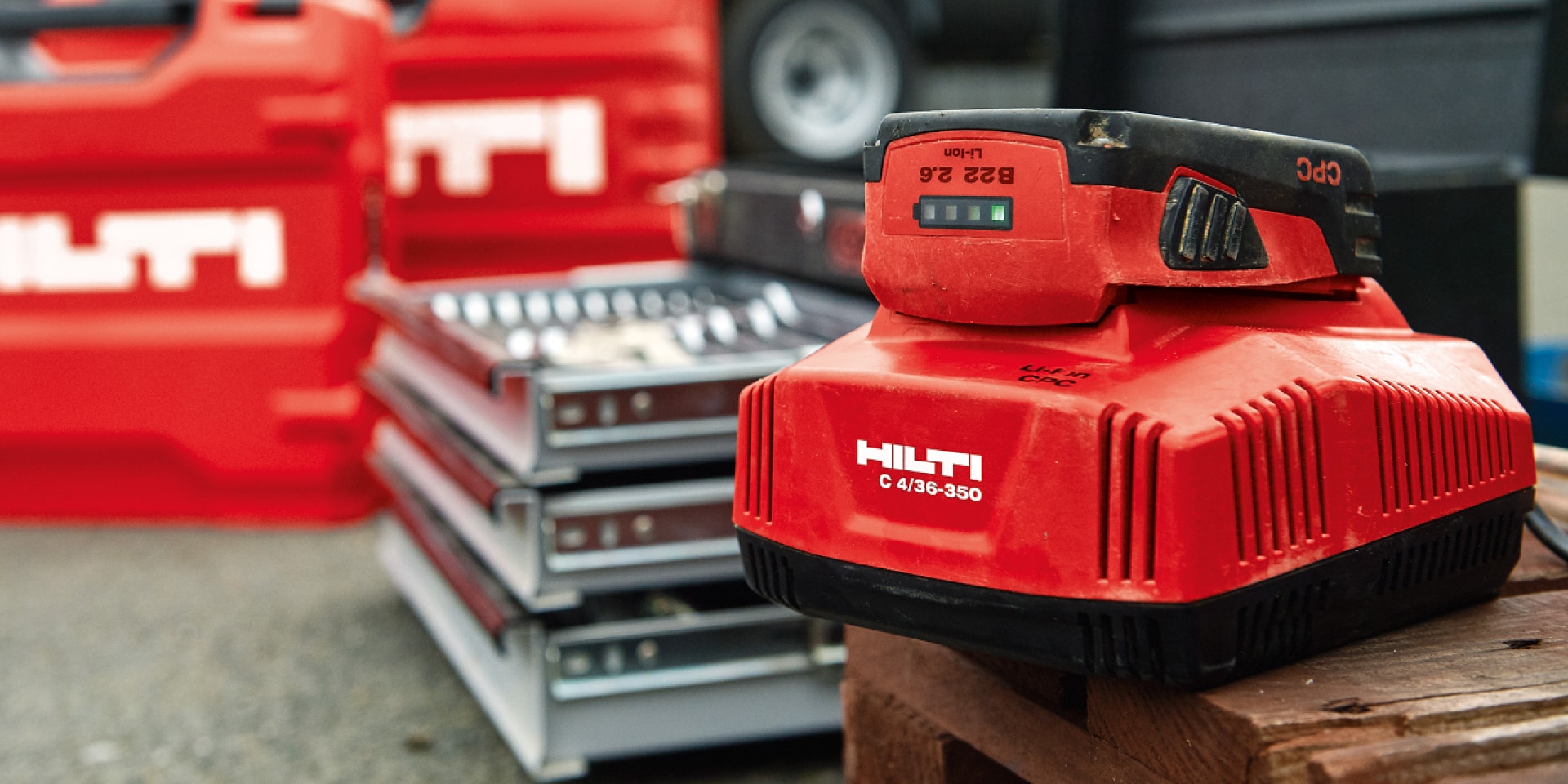 Hilti charger charges a battery on a job site
