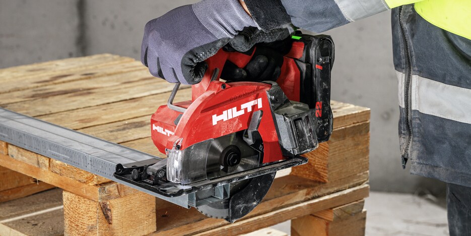 man using circular saw