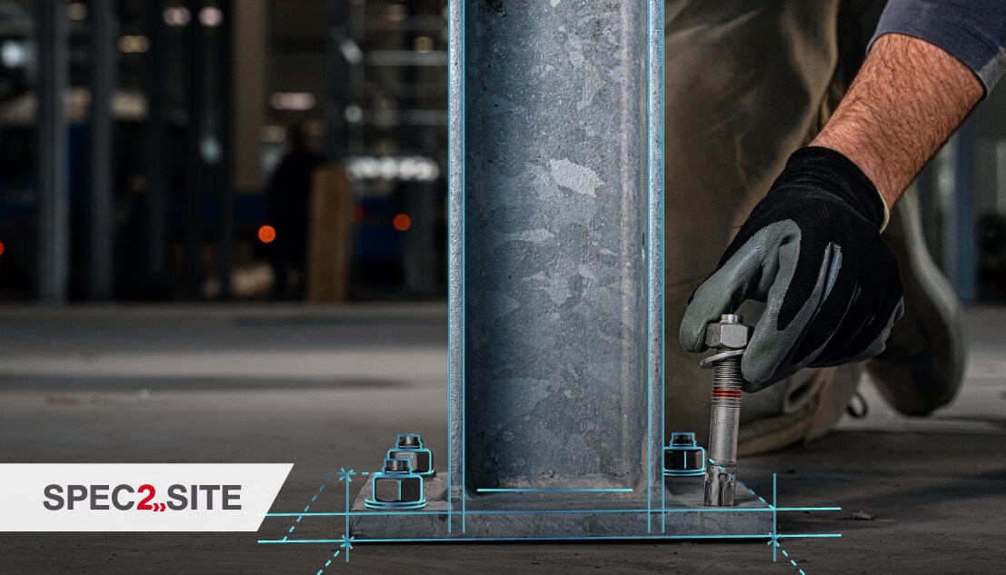 A worker installs a baseplate by inserting an expansion anchor into a hole