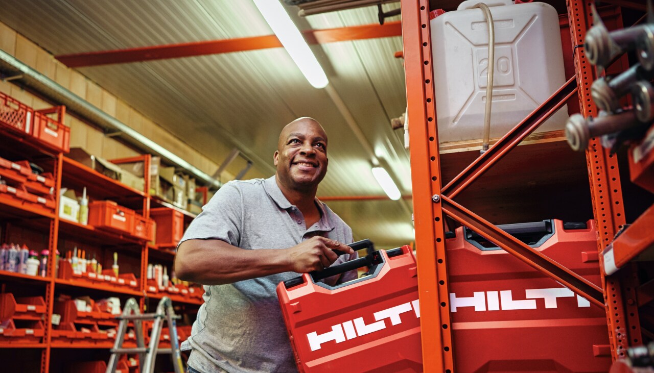 Tool Crib Manager putting away a Hilti Tool Box on a shelf in the warehouse