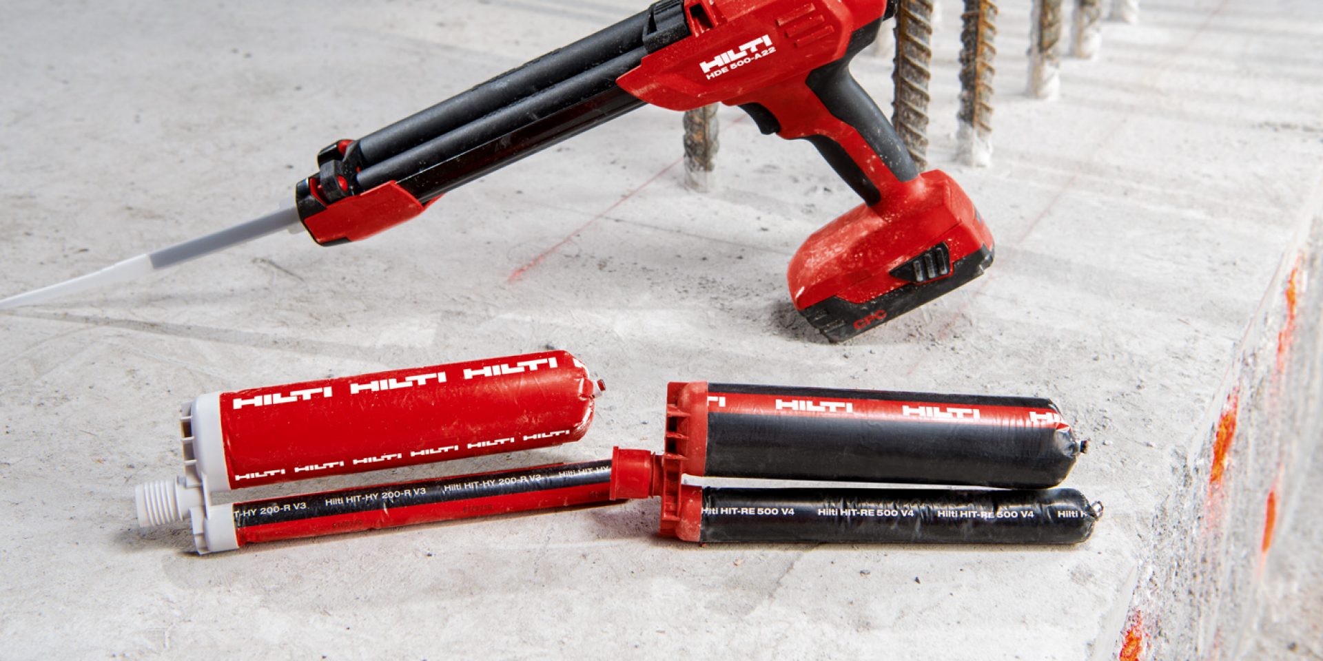 workman injecting concrete with dispenser 