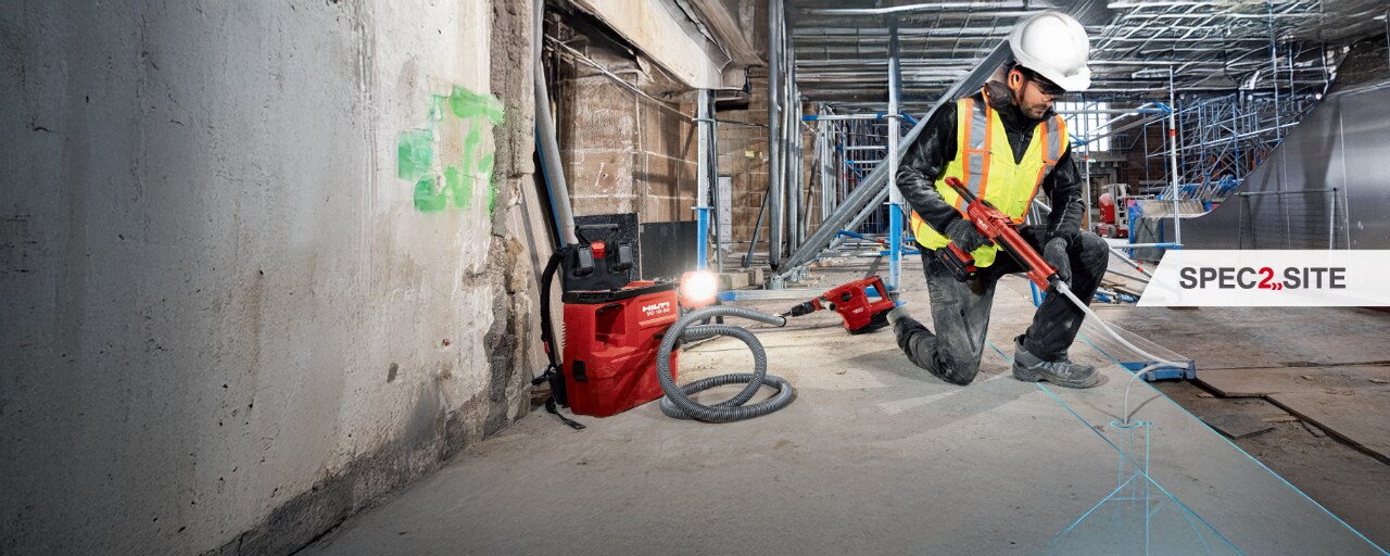 Man using Hilti's spec2site solution in a construction site area. 