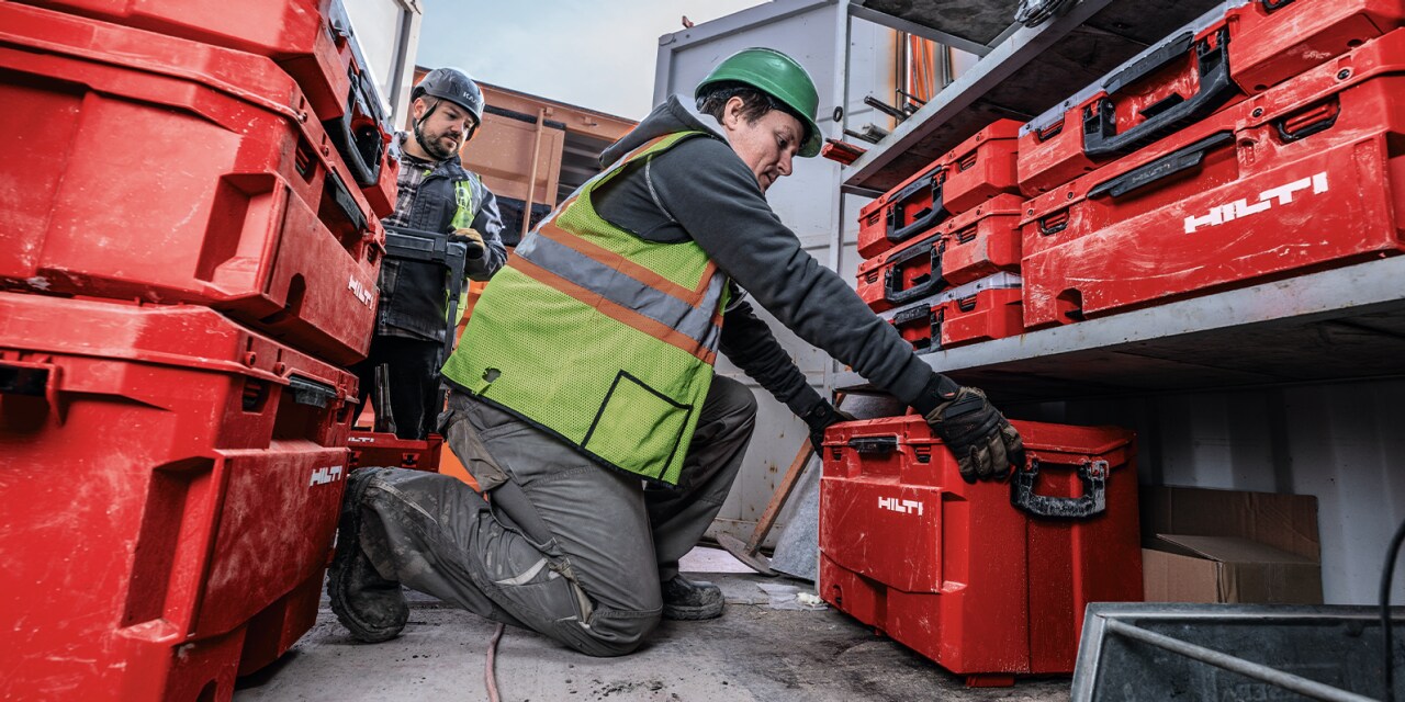 Jobsite working stocking up Hilti tool boxes