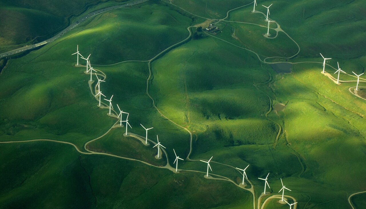 beautiful green aerial view of windmill farm providing eco-friendly energy sustainabilityÂ 