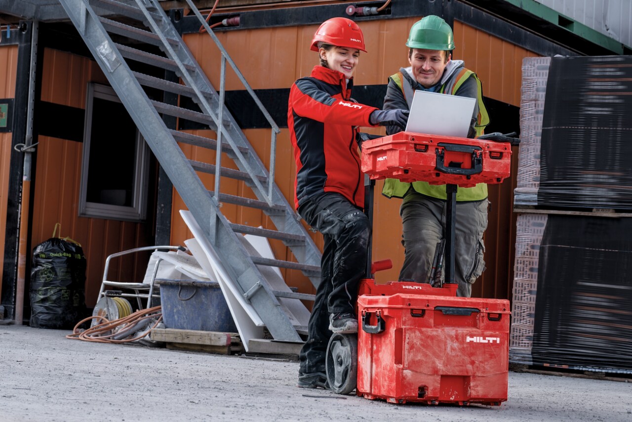  Two people looking at laptop on top of Prokit