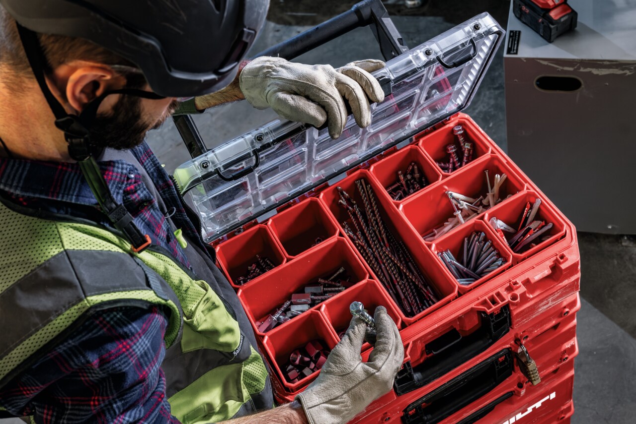 Overhead view of man opening the consummables compartment of the Prokit Portrait