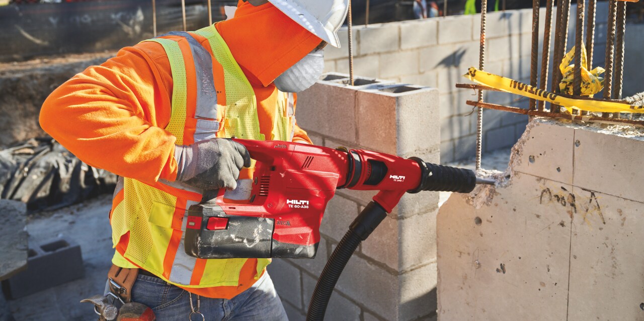 Construction worker using a TE 60-A36 Cordless combihammer  with Active Torque Control (ATC) to help prevent kickback