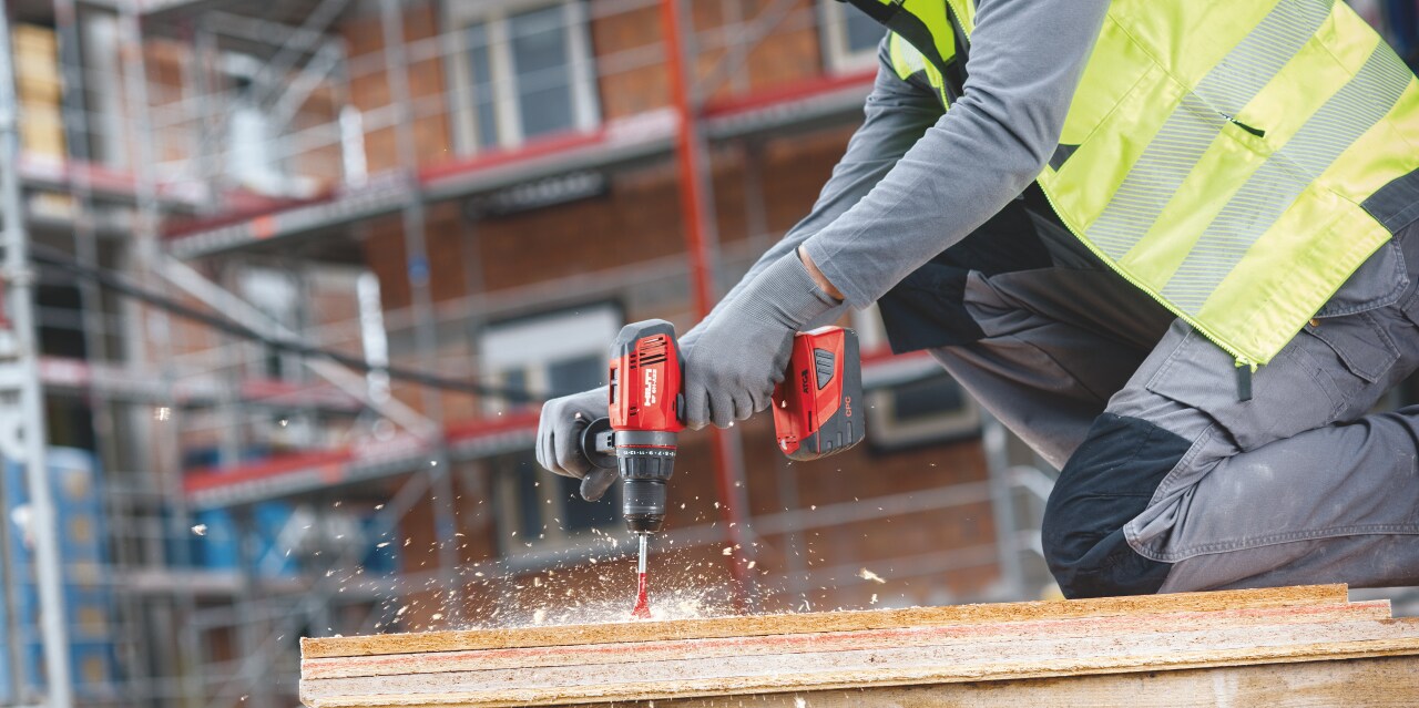 Construction worker using a n SF 6H-A22 Cordless hammer drill driver with Active Torque Control (ATC) to help prevent kickback
