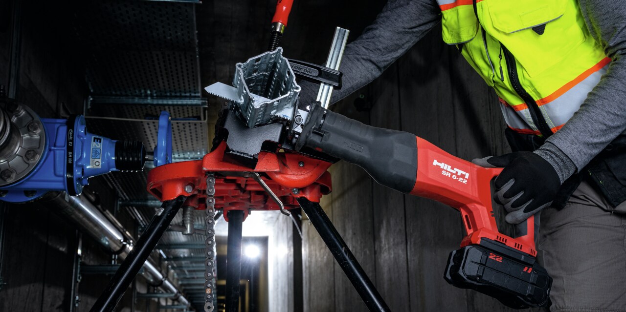 man using reciprocating saw 